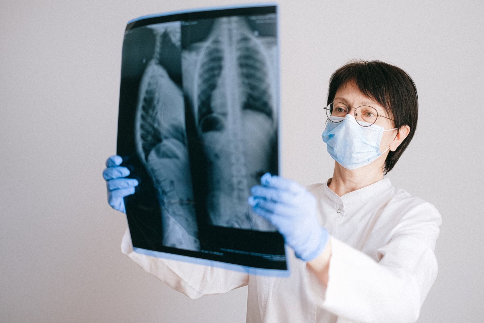 A clinician examining a chest scan image