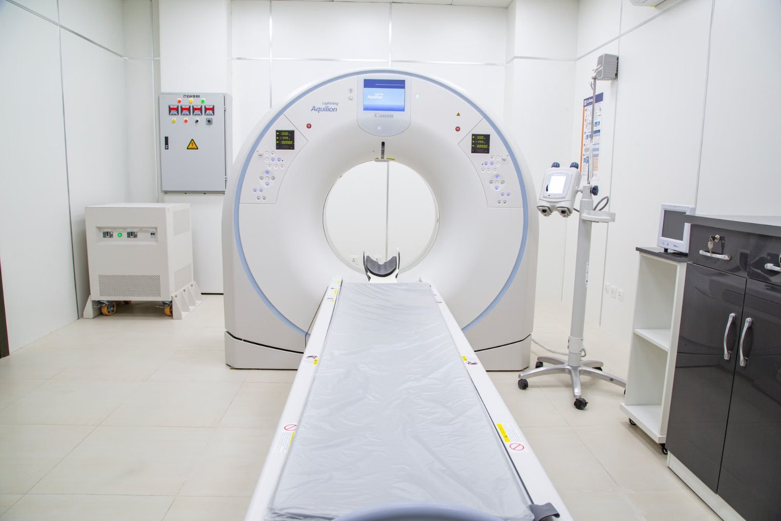 A CT scanner and patient table seen from the front
