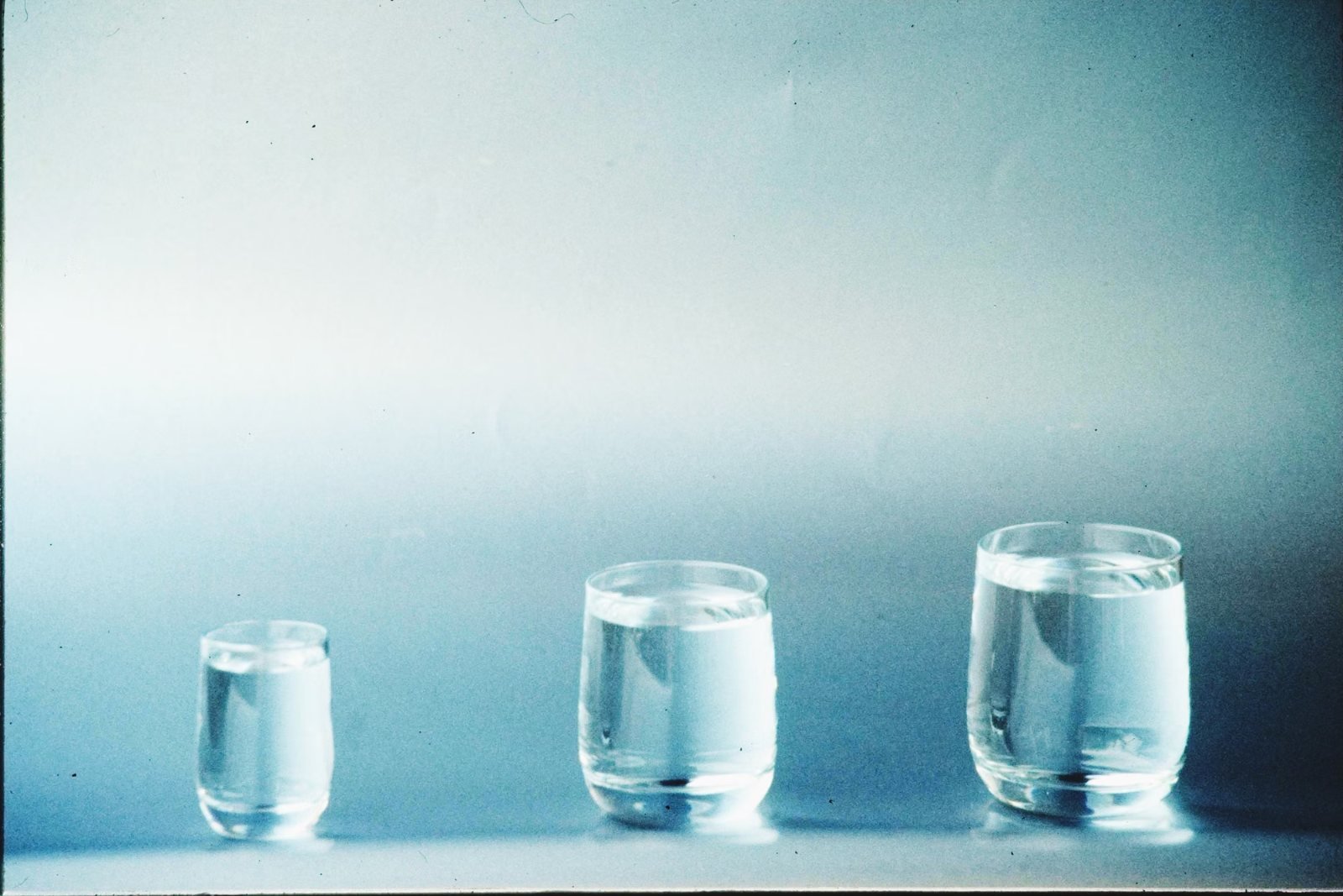 Two glasses of water on a table