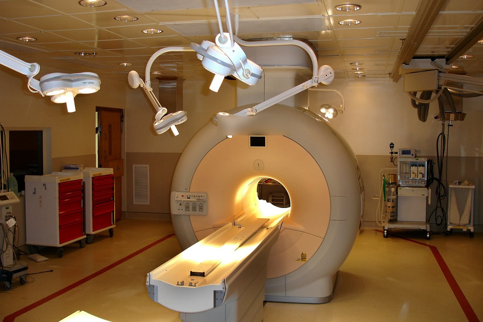 An MRI scanner in a quiet, empty scanning suite
