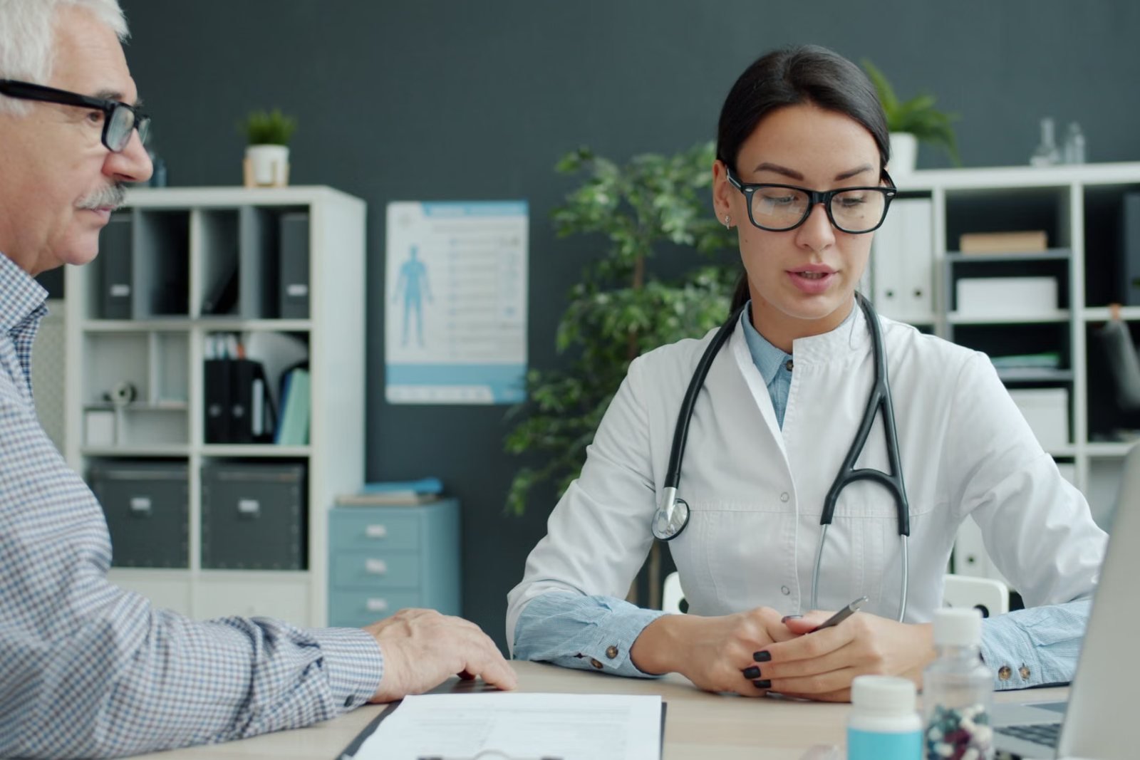 An older man talking with a doctor in a consulting room