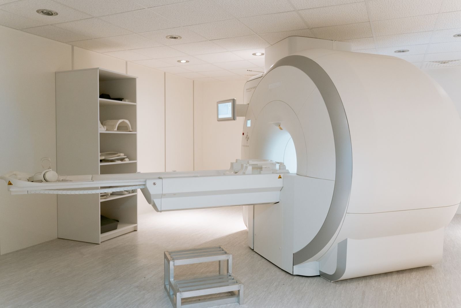 An MRI scanner in a bright, modern imaging room
