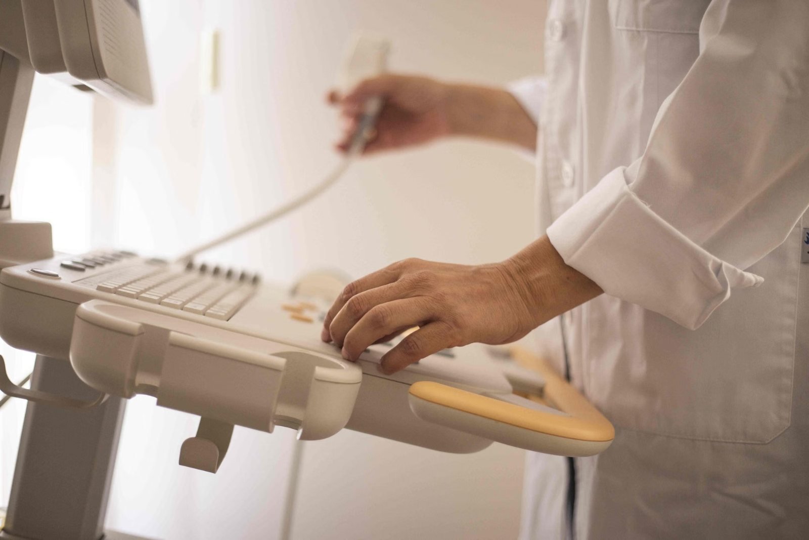 A sonographer performing a heart ultrasound