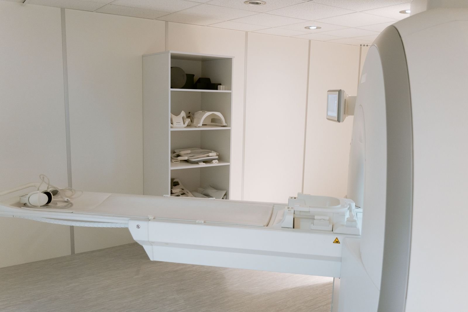 An MRI scanner table in a clean imaging room